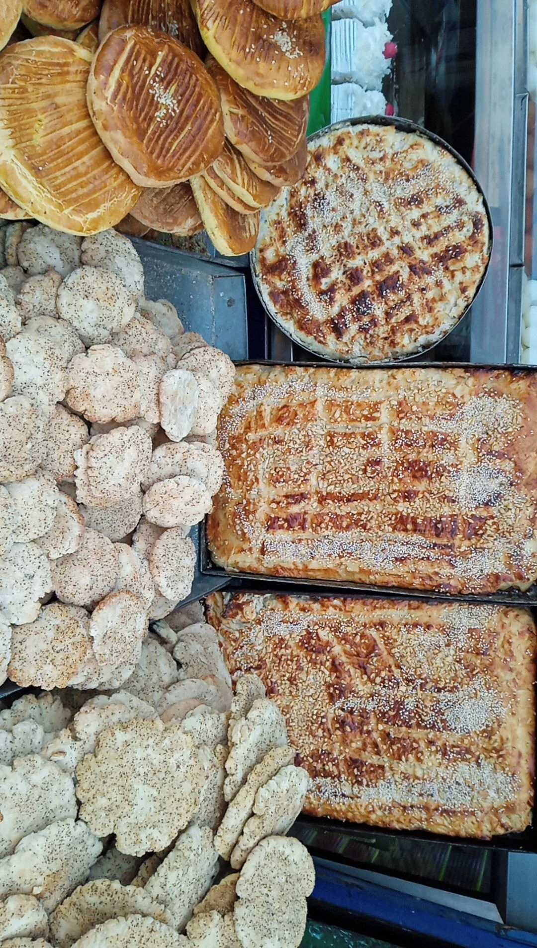 Traditional Kashmiri breads laid out at a bakery