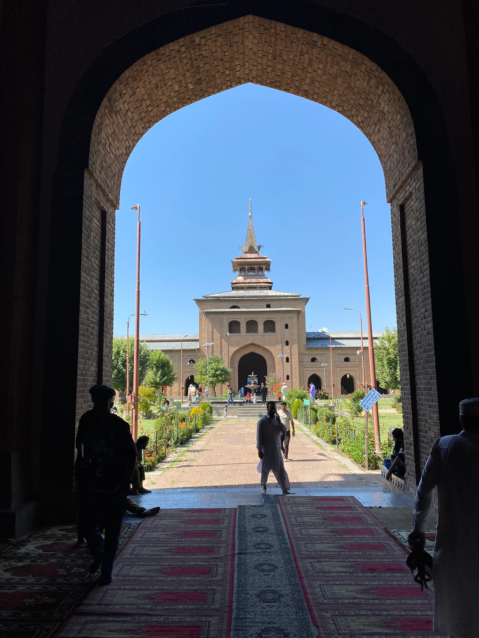 The Jamia Masjid courtyard seen through an arched gateway